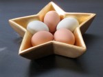 Original photo of brown and blue eggs in gold star dish. Photo by Sharyn Dimmick.