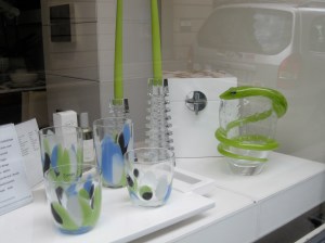 Glassware and candles in Paris shop window.