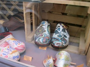 Photo shows window display of hand-painted shoes in the Marais.